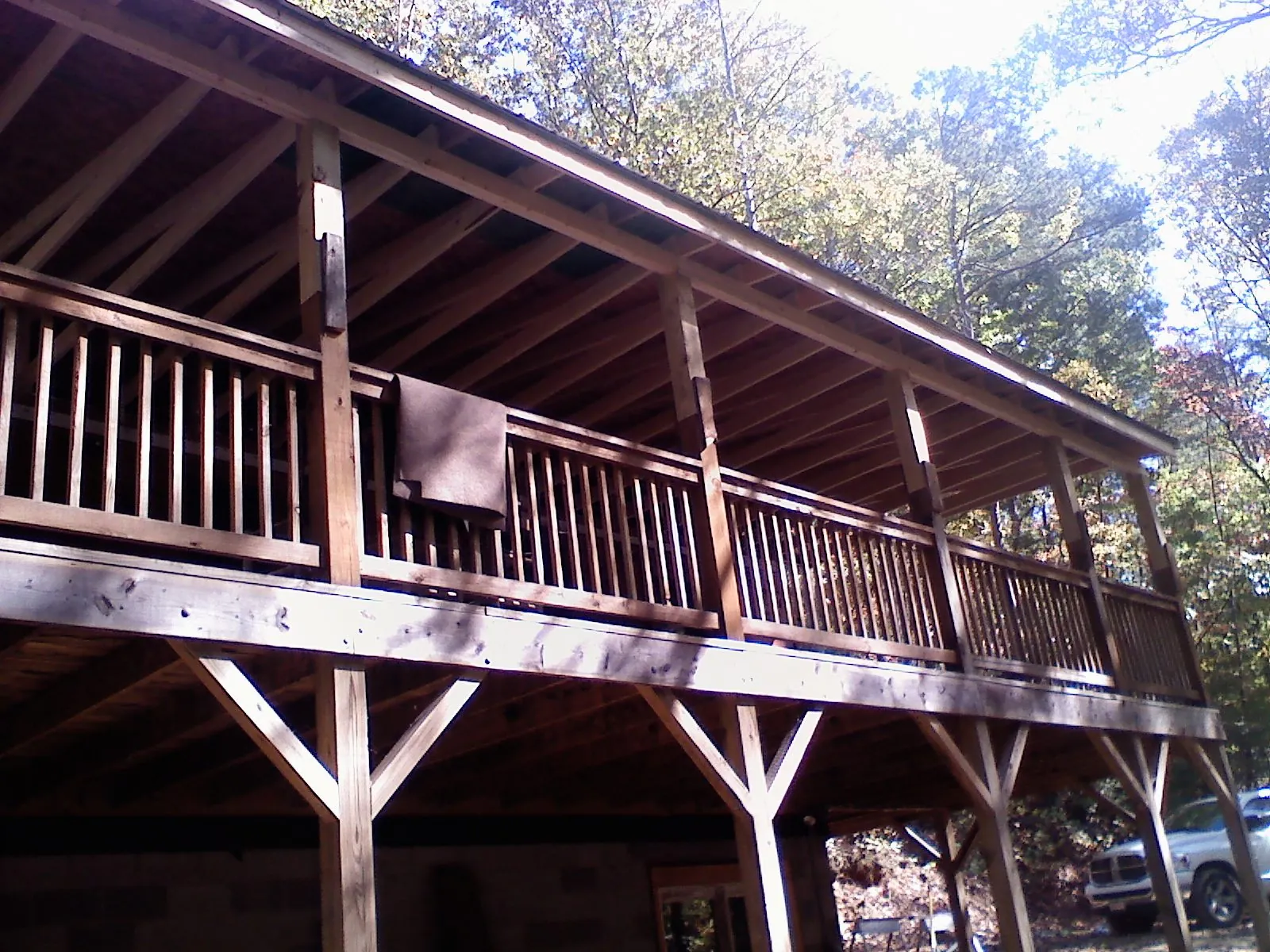 Timber framing under a new elevated porch and deck — Roof Leak Repair in Grass Lake by Roofing Brothers